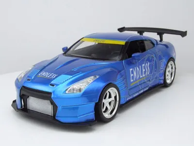 Obrázok produktu pre Nissan GT-R R35, model Ben Sopra, japonská verzia (JDM), modrá farba, model auta v mierke 1:24, značka Jada Toys, rok výroby 2009