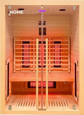 Interior view of a wooden infrared sauna cabin with red heating elements.