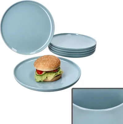 A stack of blue plates and one plate with a hamburger on it, with a close-up of the plate rim in the bottom right corner.