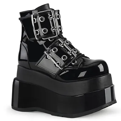 A black patent leather platform boot with multiple buckles and straps.