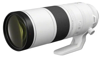 A white and black Canon telephoto lens is shown against a white background.