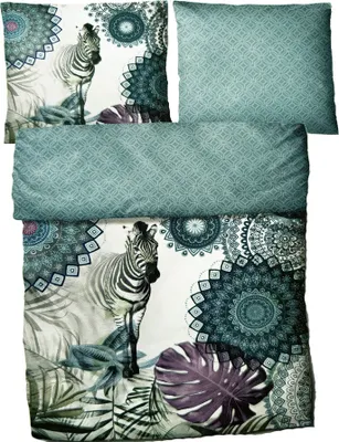 A bedding set with a zebra and mandala pattern, including a duvet cover and pillowcases.
