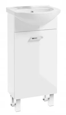 A white bathroom cabinet with a sink on top, standing on four legs.