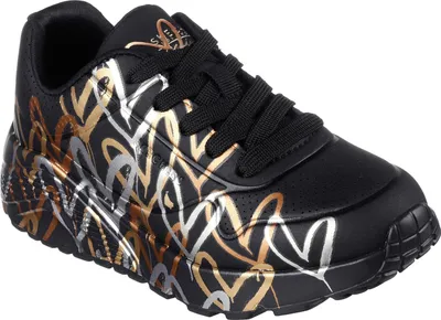 A single black sneaker with a heart pattern on a white background.