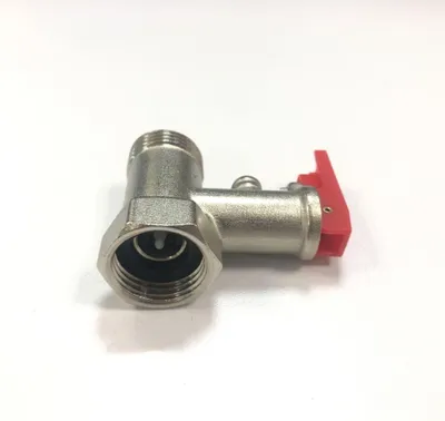 A close-up studio shot of a brass pressure relief valve with a red lever, set against a plain white background.