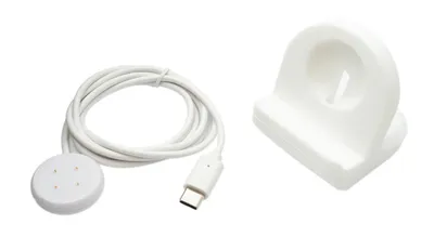 A white USB charging cable with a magnetic puck and a white charging stand for a smartwatch, isolated on a white background.