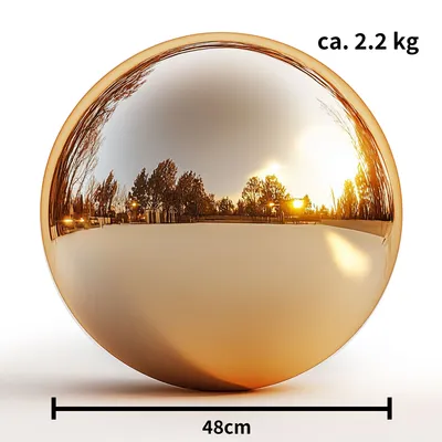 A large, polished gold sphere reflecting trees and a sunset.
