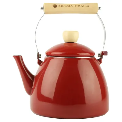 A red enamel kettle with a wooden handle is shown against a white background.