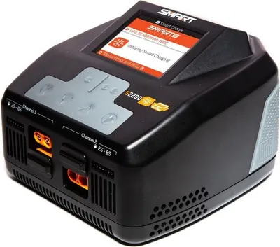 A black battery charger with a screen and multiple ports.