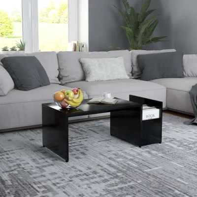 A modern living room scene with a couch, coffee table, and rug.