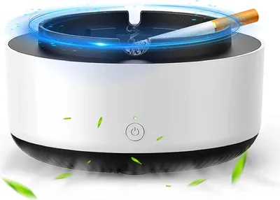A portable ashtray with a built-in air purifier, shown with a cigarette burning.