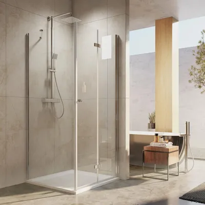 A modern bathroom with a shower enclosure, bathtub, and vanity.