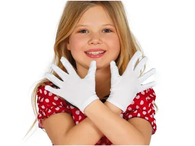 A young girl wearing white gloves and a red polka dot dress, posing with her hands in front of her.
