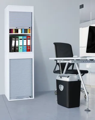 An office scene with a filing cabinet and a desk.