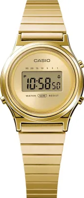 A close-up studio shot of a gold Casio digital watch.