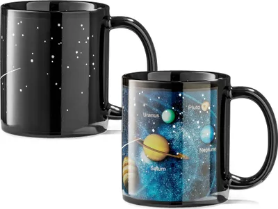Two mugs, one showing a starry night sky and the other displaying planets of the solar system.