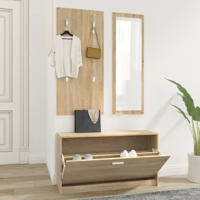 Entranceway with coat rack, mirror, and shoe storage.