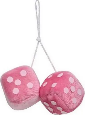 Two pink fuzzy dice with white polka dots hanging from a white string.