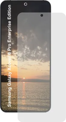 A screen protector is placed over a smartphone displaying a sunset over water.