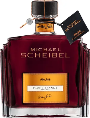 A bottle of prune brandy on a white background.