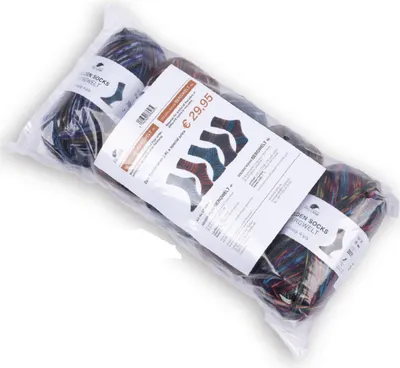 A plastic bag containing several balls of yarn, with a printed label and price.