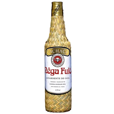 A bottle of Cachaça with a woven straw-like covering.