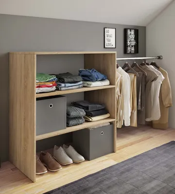 A wooden open wardrobe with clothes and storage boxes, next to a clothing rack with hanging clothes.