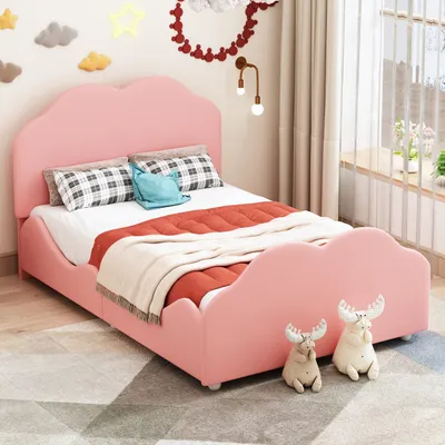 A child's bedroom with a pink cloud-shaped bed.