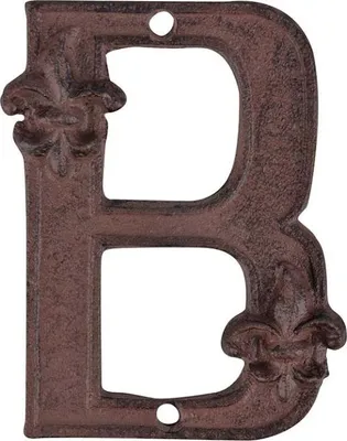 A single cast iron letter 'B' with fleur-de-lis embellishments.