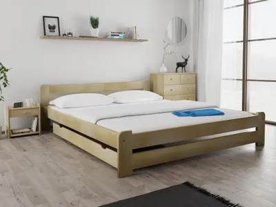 A bedroom scene with a wooden bed as the main focus.