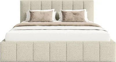 A bed with bedding and pillows, shown from the front.