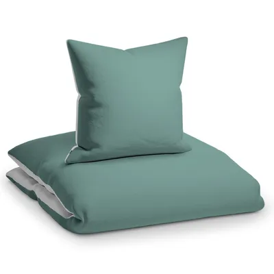 A folded duvet and a pillow, both in teal and light gray colors, are presented on a white background.