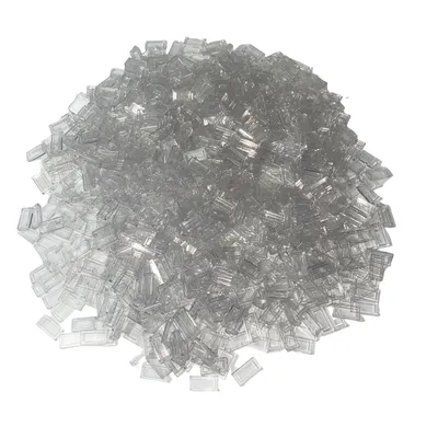 A pile of small, transparent, rectangular building blocks.