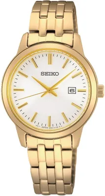 A close-up studio shot of a gold Seiko watch with a white dial.