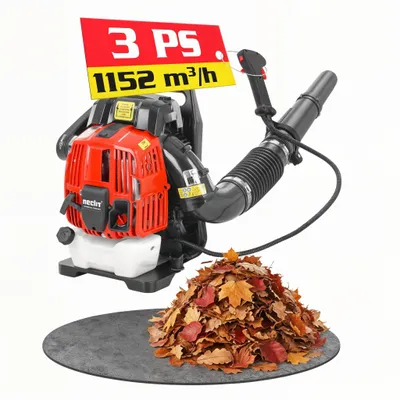 A red and black leaf blower with a pile of leaves in front of it, set against a white background.