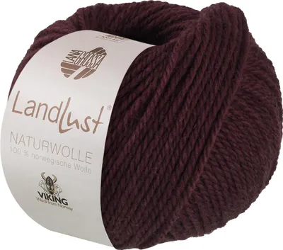 A ball of burgundy yarn with a label.