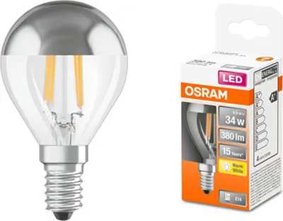 A product shot of an LED light bulb next to its packaging.