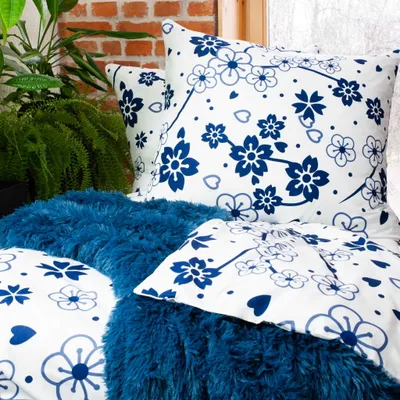 A close-up view of bedding with a floral pattern.