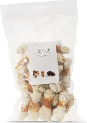 A clear plastic bag filled with dog chews, with a label in the front.