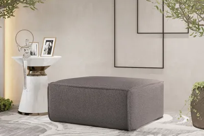 Produktbild von Polsterhocker Designerhocker CELES PREMIUM 85x85 cm Stoff Ascot Bukla Taupe