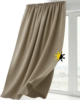 A light brown curtain hanging in front of a window.