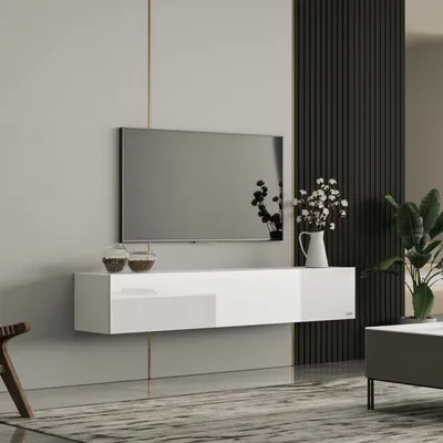 A modern living room with a wall-mounted TV and a white, high-gloss TV lowboard.
