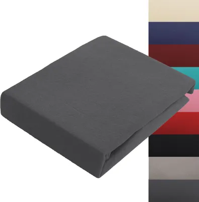 A folded dark gray fitted sheet is shown on a white background. To the right of the sheet, there is a vertical strip of swatches of different colored fabrics.