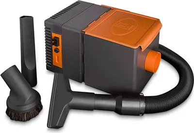 A vacuum cleaner with accessories on a white background.
