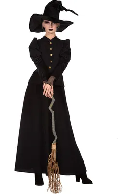 A woman dressed as a witch, holding a broomstick, against a white background.