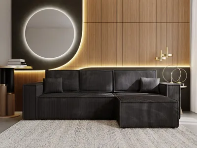 A modern living room with a sectional sofa, a large round mirror with backlighting, and wood-paneled walls.