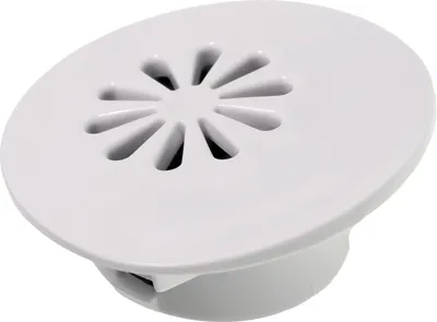 A white plastic vent for a kitchen appliance.