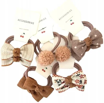 Produktbild von Haargummis - Kinder-Haargummibögen - Stilvolle Schleifen für Mädchen - Stark und Elastisch - Farbenfrohe Accessoires - Kleine Größe - Lang anhaltende