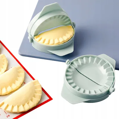 Two dumpling makers, one with dough inside, are shown on a blue mat and a red mat.