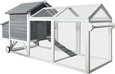 A wooden chicken coop with an attached run, shown outdoors on a white background.